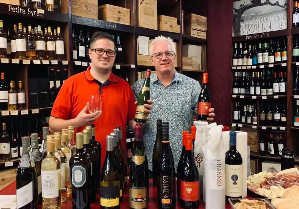 Two of the Pearson's team pouring at a tasting table in the shop
